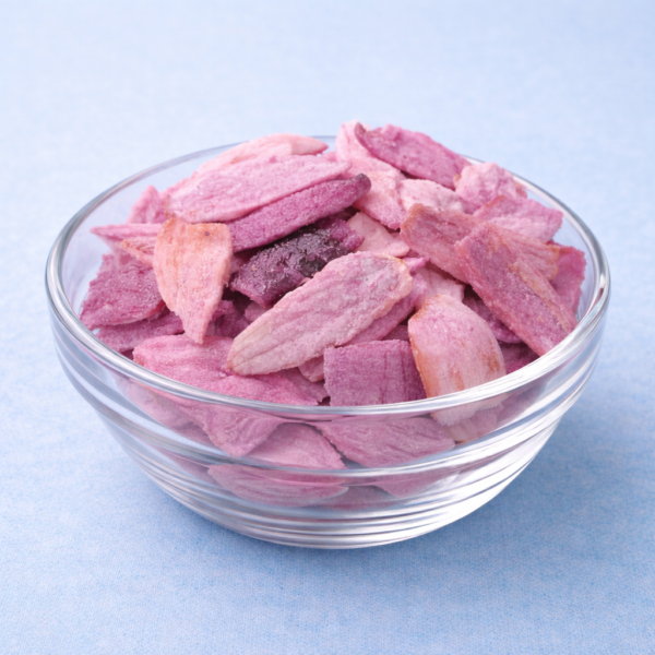 Crispy onion slices served in a small glass bowl on a neutral background